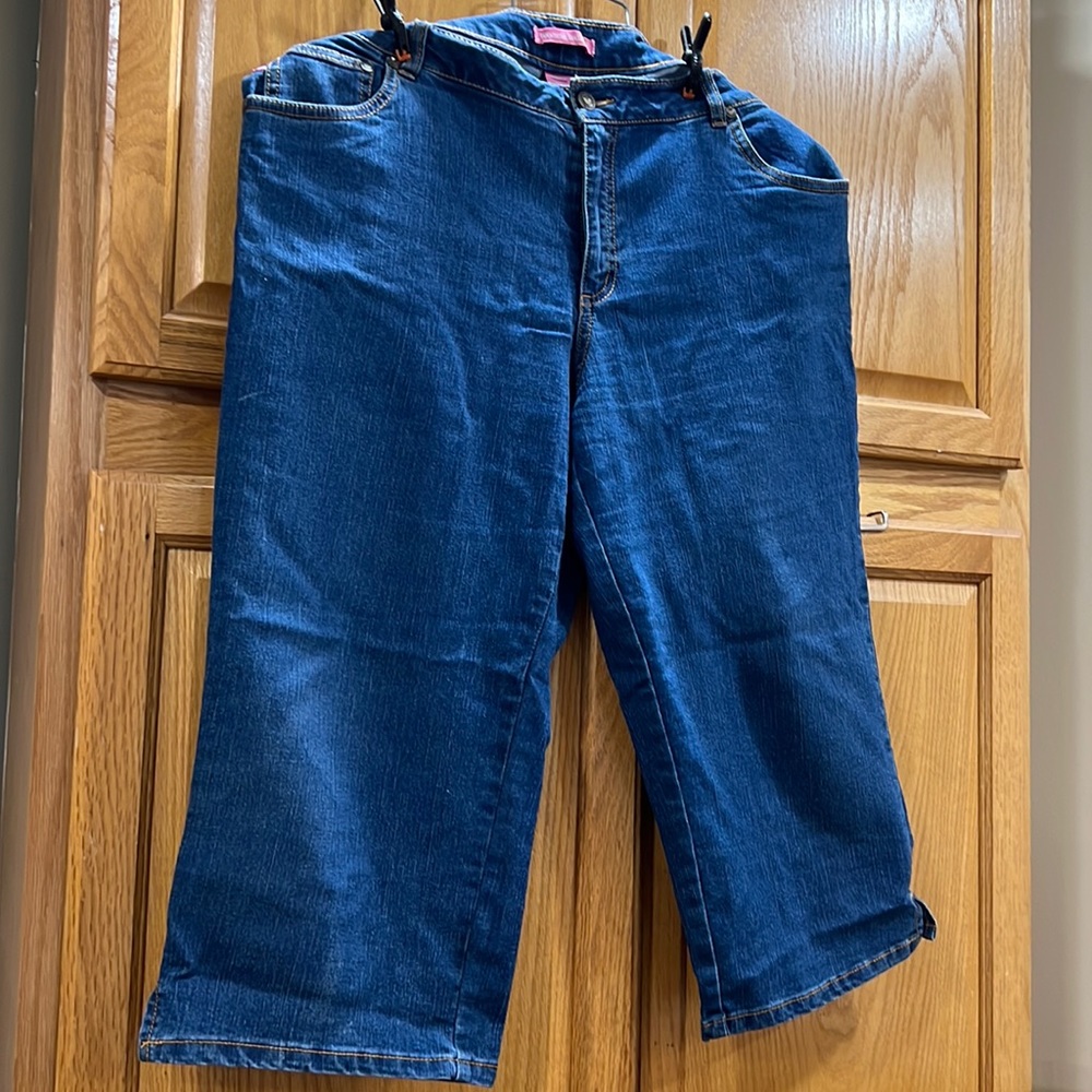 Woman within lighter blue denim Capri pants size 16w